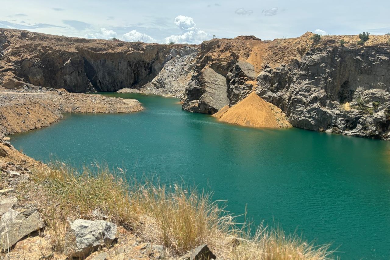 Workers in a mining site wearing safety gear